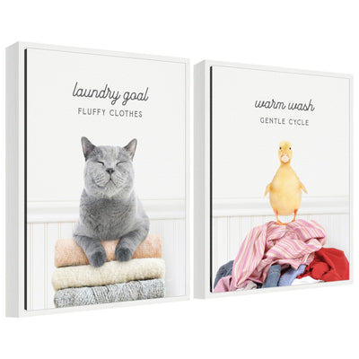 Framed canvas art set showing "Sylvie Cat Laundry Goals" and "Ducky Gentle Cycle" animal illustrations.