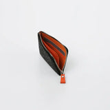 Black textured coin purse with silver zipper and bright orange interior compartments, shown open on a white background.