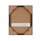 Back of a framed artwork showing brown cardboard backing secured with four corner tabs and a central label explaining potential size and shape variations.