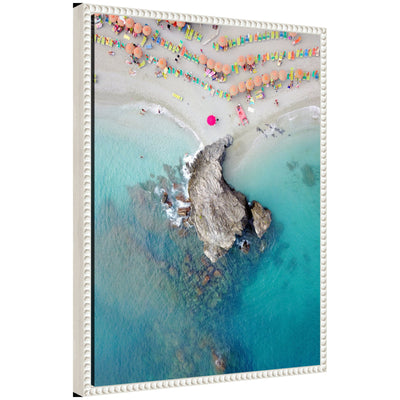 Sylvie Monterosso 7 framed canvas artwork showing a beach scene, with a vintage beaded polystyrene frame