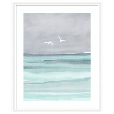 Framed watercolor art print showing seagulls flying over gentle waves in soft blue and gray tones