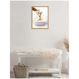 Framed canvas showing a mother giraffe and baby giraffe in a pastel pink bathtub with delicate floral greenery on a white background, hanging above a white bench with a cream fur throw.