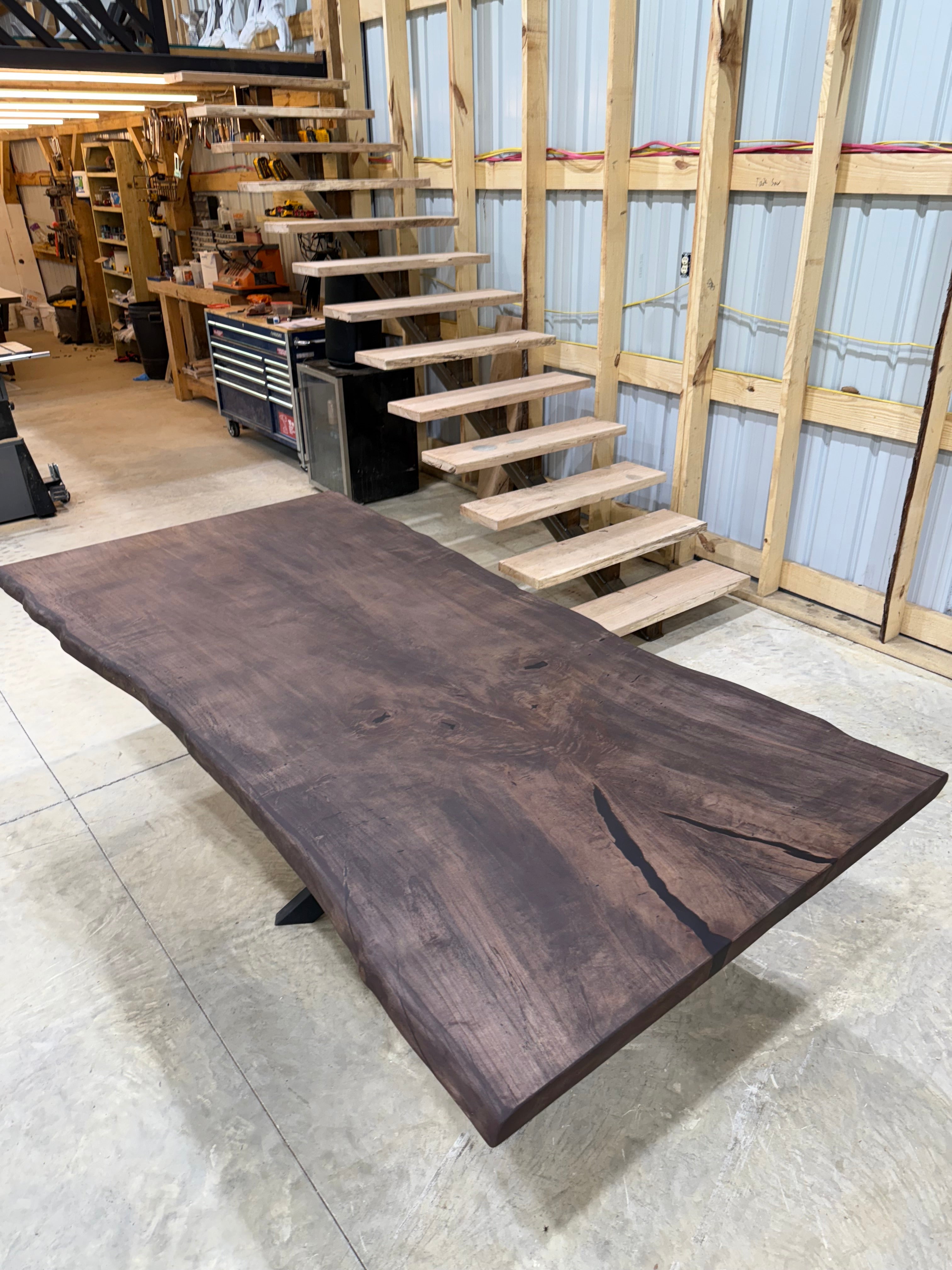 8x~4 Maple Slab Table with chocolate stain and spyder base by Sasquatch Tables LLC