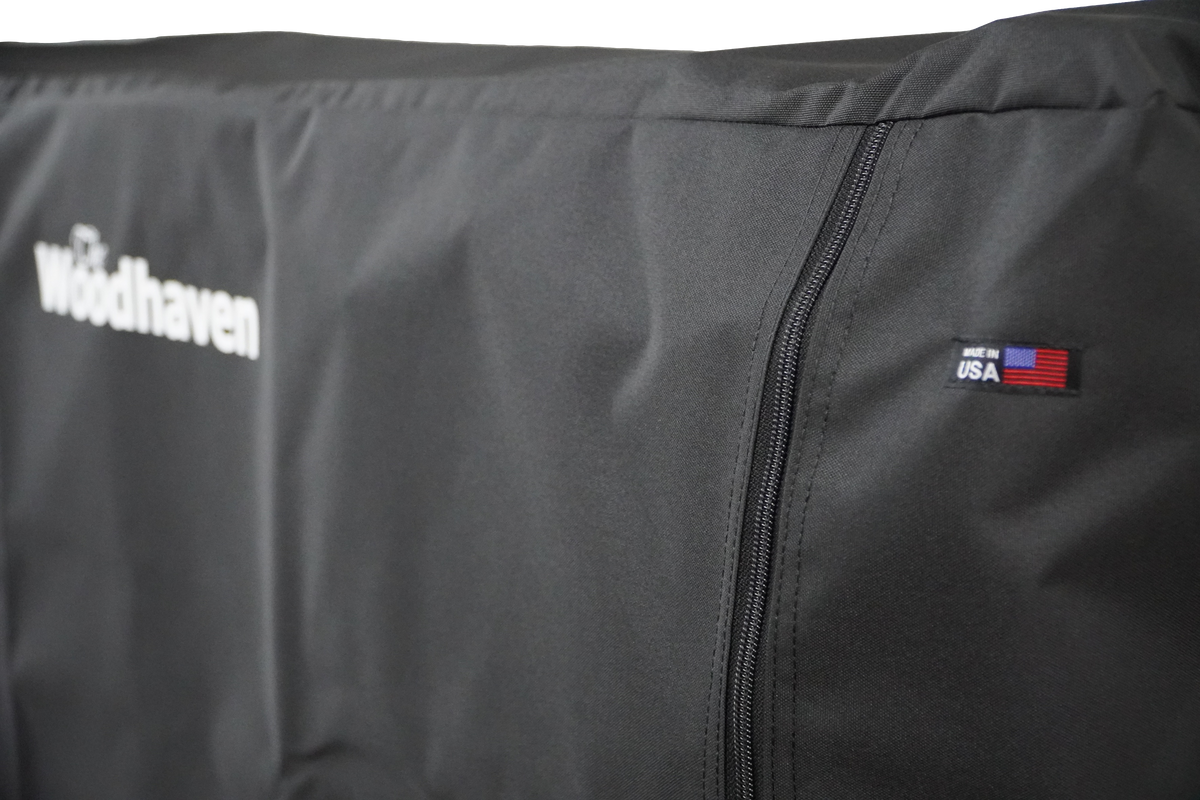 Woodhaven Full Firewood Rack Cover with zipper closure protecting stacked firewood outdoors