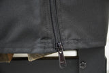 Woodhaven Full Firewood Rack Cover with zipper closure protecting stacked firewood outdoors
