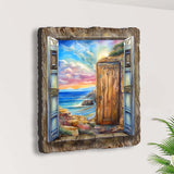 Artwork showing an open blue window frame revealing a wooden door, rocky coastline, and vibrant sunset sky with clouds and distant water view.
