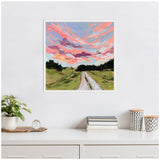 Square framed canvas painting depicting a rural road under a vibrant sky with swirling pink, orange, and purple clouds above green fields and dark tree silhouettes.