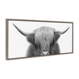 Framed canvas showing a close-up of a Highland cow with long shaggy hair covering its eyes and prominent wide horns, set against a plain white background.