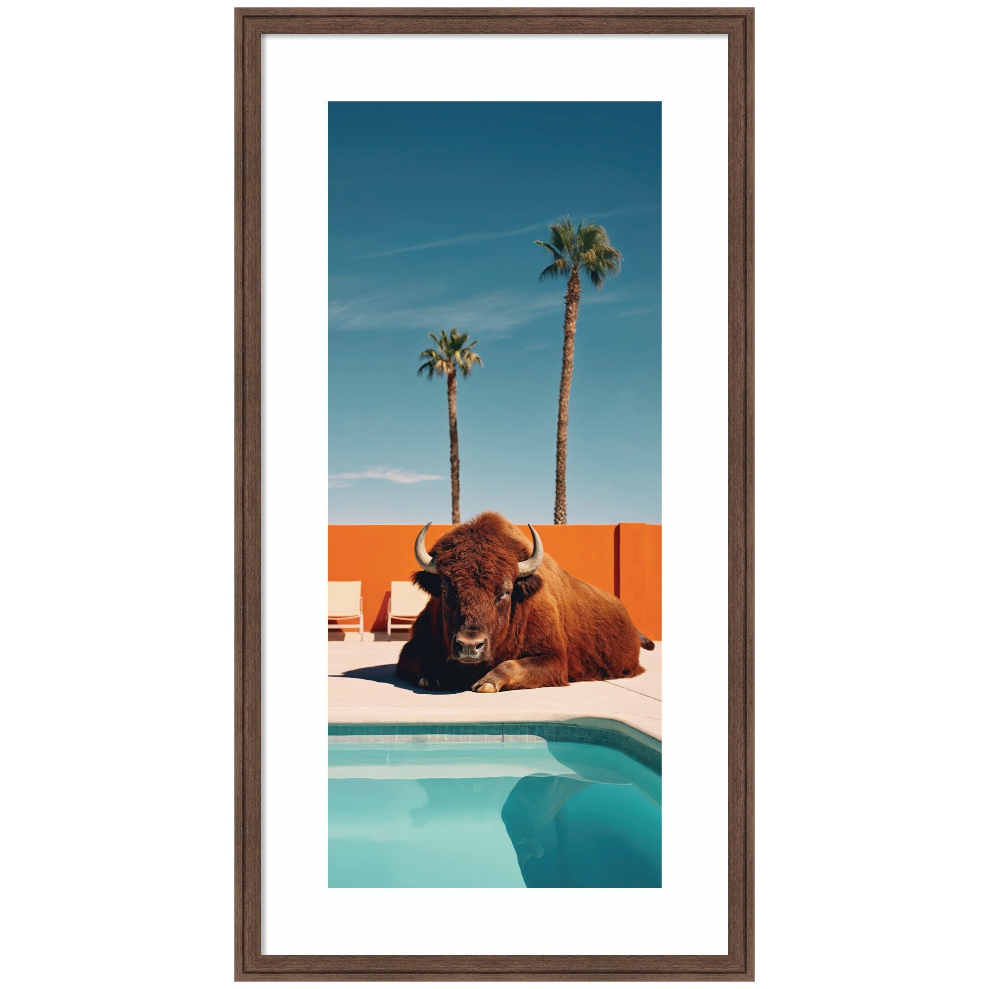 Framed Art featuring a bison lounging by a turquoise pool with two palm trees and an orange wall background