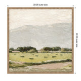 Framed canvas print of a serene landscape with muted green fields, dark green tree clusters along the horizon, and a pale textured sky above.