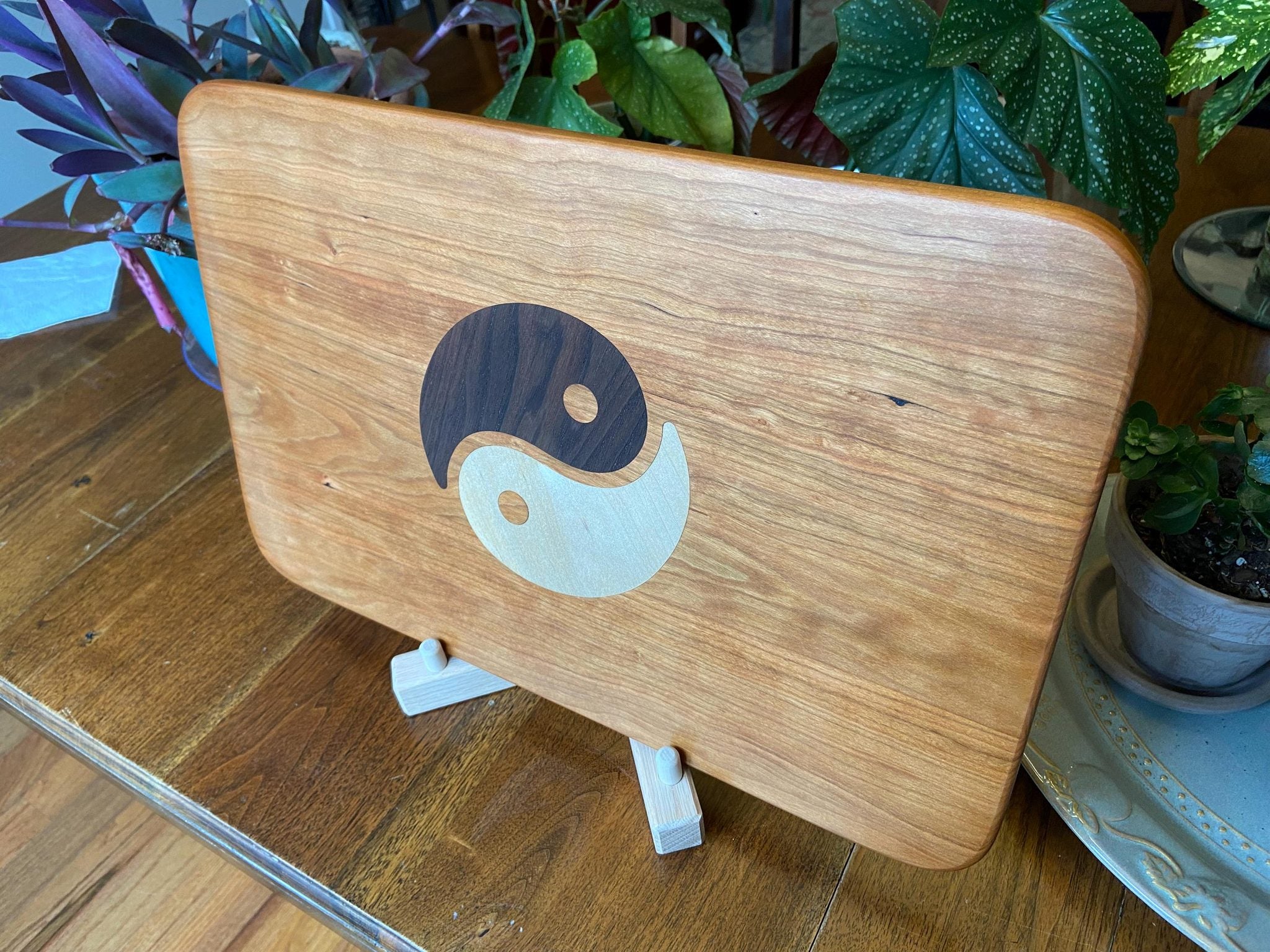 Cherry wood charcuterie board with Yin Yang inlay made from Peruvian walnut and maple