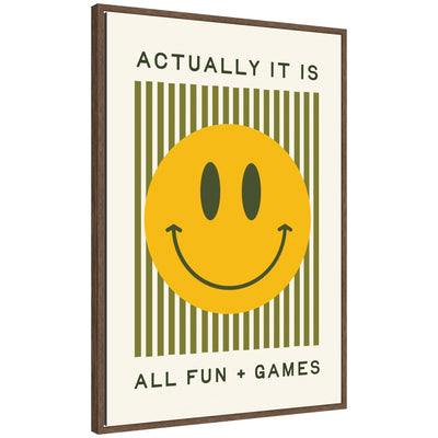 Framed canvas wall art of striped smiley face by Lucky Guava titled 'It is All Fun and Games', with a walnut brown Sylvie frame.