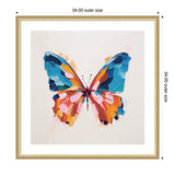 Framed abstract butterfly artwork with vibrant blue, orange, and pink brush strokes forming wings on a light neutral background.