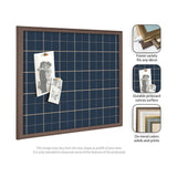 Square pinboard with navy blue plaid fabric and thin wooden frame, displaying two black-and-white photos pinned with copper tacks.