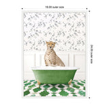 A cheetah sits calmly inside a vintage green clawfoot bathtub filled with white bubbles, set against white wainscoting and floral wallpaper with green and black leaf patterns.