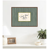 Framed canvas wall art with black and white vertical stripes surrounding a central white rectangle that reads 'Love You More' in dark cursive, accented with small gold stars