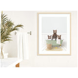 Framed print of three brown bear cubs sitting in a pale green clawfoot bathtub with a towel hanging over the edge and a wicker basket and yellow rubber duck nearby.