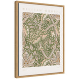 Framed William Morris Windrush 1883 print with intricate cream and green floral and leaf patterns on a muted green background, bordered by white mat and light wood frame.