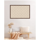 Rectangular beige pinboard with a dark wooden frame and a green lattice pattern, displayed above a light wood bench with neutral pillows and a soft pink throw.