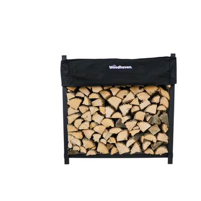 Woodhaven 4 ft Firewood Rack holding stacked firewood outdoors