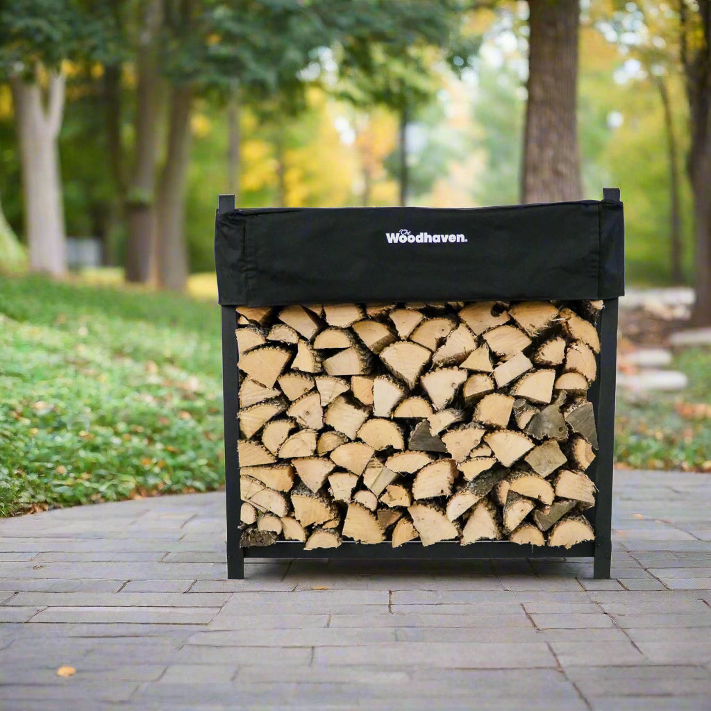Woodhaven 4 ft Firewood Rack holding stacked firewood outdoors