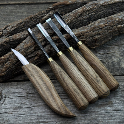 5-piece wood carving tool set with whittling knife and four chisels on wooden surface