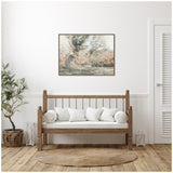 Wood-framed canvas featuring a cheetah resting in tall grasses with soft natural colors, hung above a wooden bench with white cushions in a minimalist room.