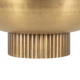 Close-up of a brass-colored metal bowl base with vertical ridges and a smooth, rounded upper section in a warm metallic finish