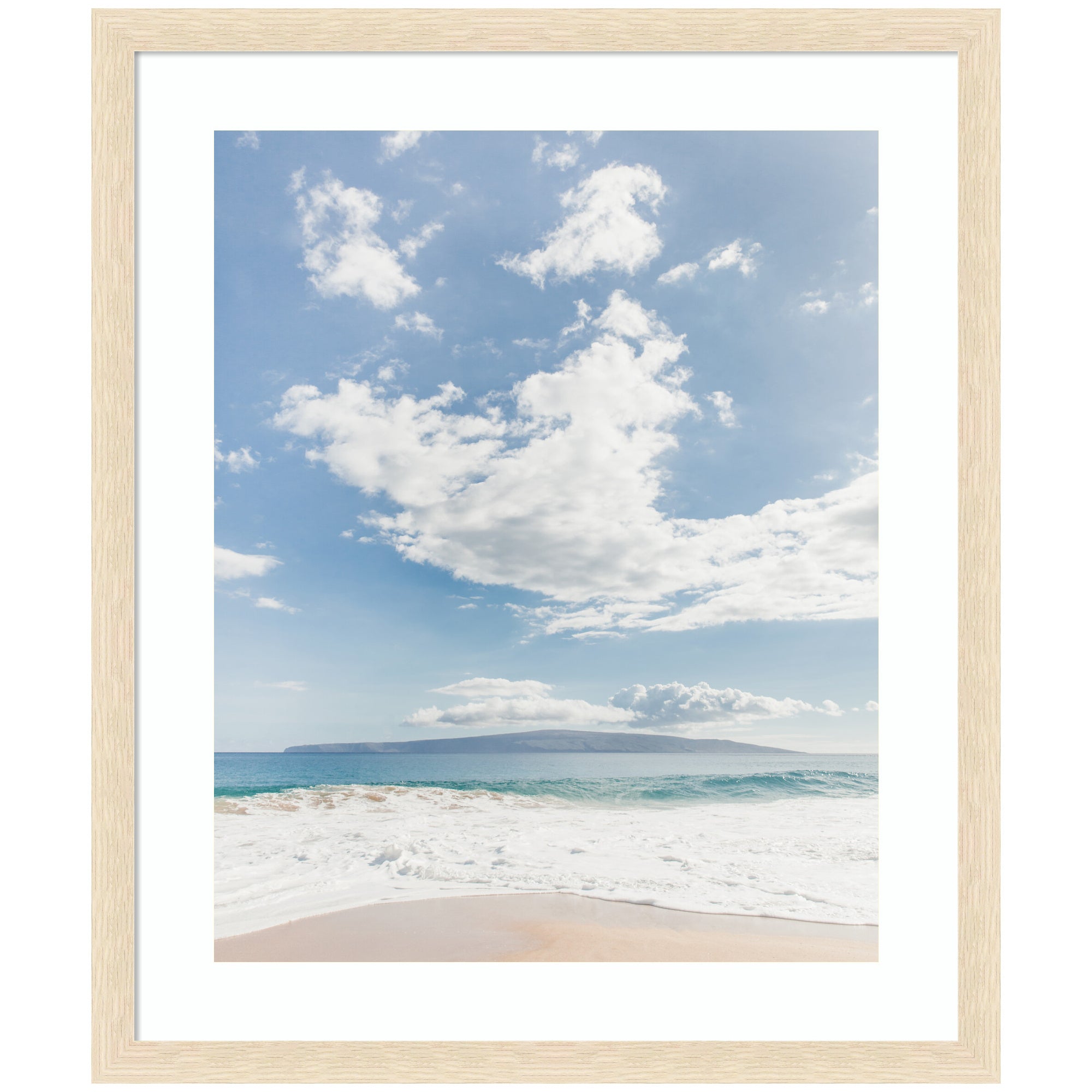 Framed Art Beach by Alicia Abla showing a calm beach with gentle waves, an island on the horizon under a partly cloudy blue sky.