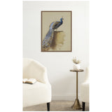 Framed canvas print of a peacock by Archibald Thorburn, featuring blue and green plumage with eye spots, hung above a brass side table between two white armchairs.