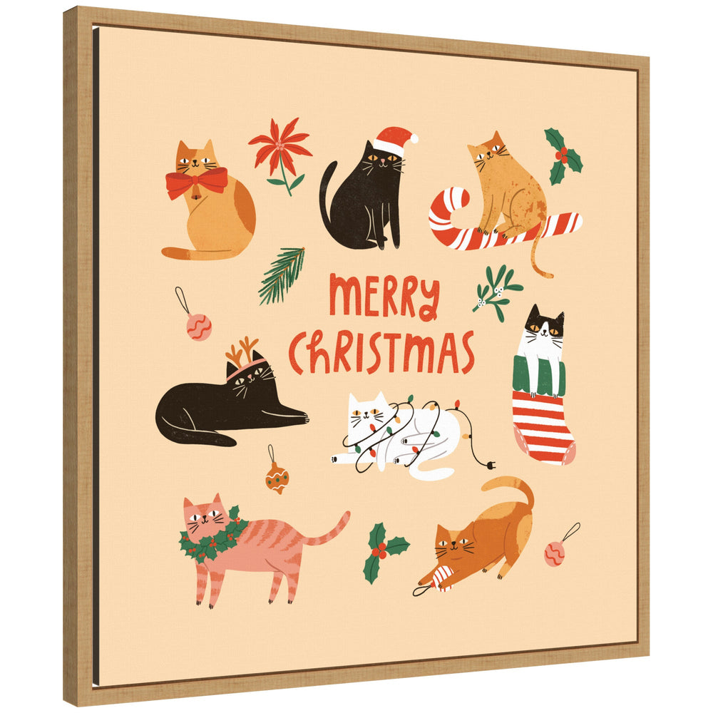 Framed canvas art showing whimsical cats in Christmas attire with "Merry Christmas" text