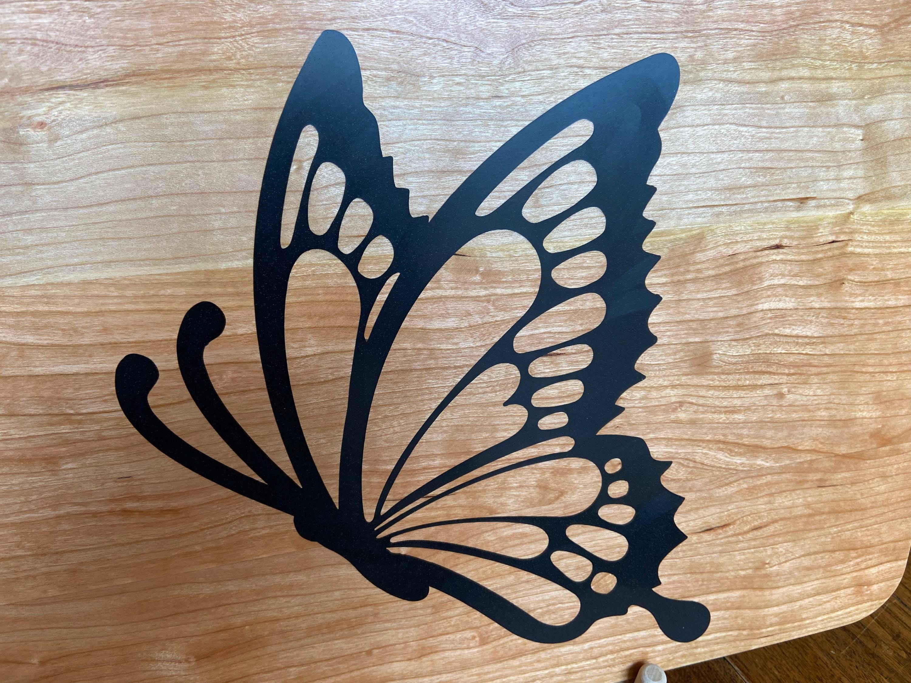 Cherry wood charcuterie board with butterfly-shaped resin inlay