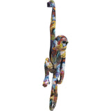 Colorful elongated ape wall hanging sculpture with a long tail and one arm raised, featuring swirling multi-color patterns of blue, yellow, and orange.