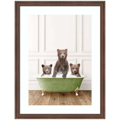 Framed wall art print of three bear cubs sitting in a transitional bathtub, surrounded by soft indoor lighting.