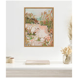 Abstract framed canvas painting of a seascape path with peach, green, and brown brushstrokes, hanging on a white wall above a shelf with dried plants in glass jars.