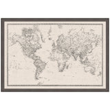 Framed vintage-style world map on textured linen fabric, featuring detailed black and white cartographic lines and labels, in a dark wood frame.