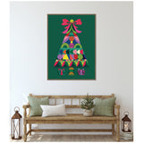 Geometric Christmas tree art with colorful shapes and patterns on dark green background, topped with a pink bow, framed and hung above a wooden bench with green and white pillows.