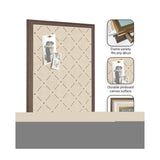 Rectangular pinboard with beige canvas featuring a subtle green lattice diamond pattern, framed in dark wood, holding two black-and-white photos clipped onto it.