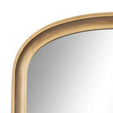 Top left corner of an arched wall mirror with a smooth, light wood frame featuring a subtle inward groove detail and a clean reflective surface.