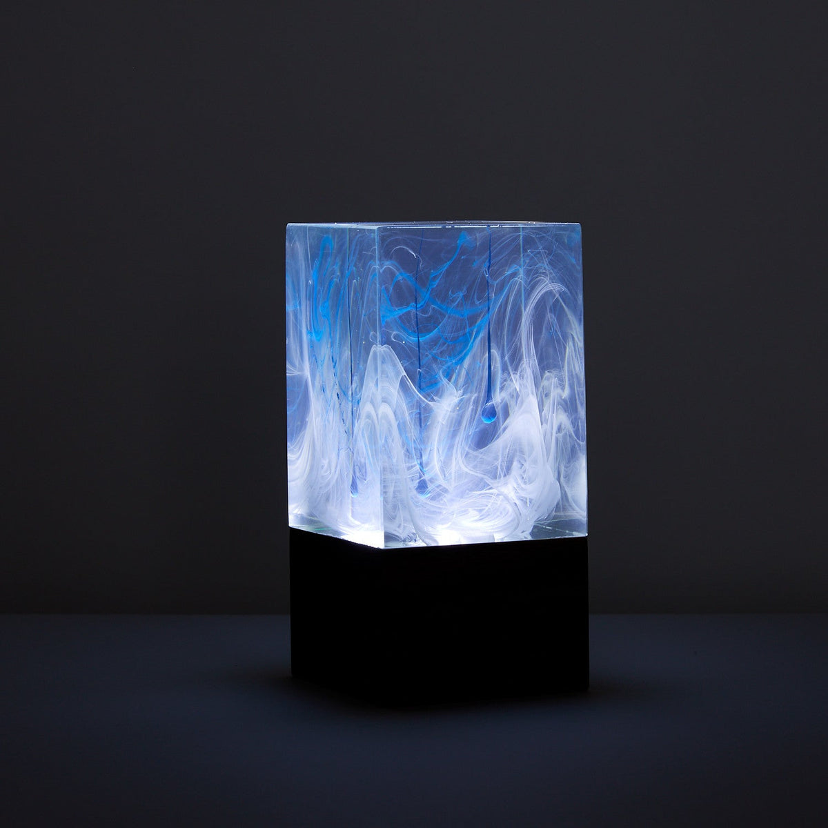 Handcrafted resin table lamp with ocean-inspired colors and warm white LED light
