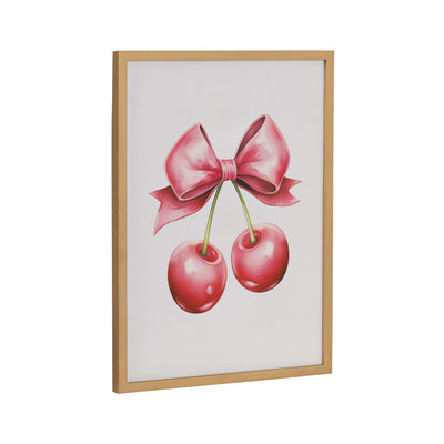 Framed print showing red cherries with pink bows on a white background in a gold frame