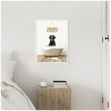 Black Labrador sitting inside a clawfoot bathtub filled with white bubbles, with a wooden sign above reading 'Hot Bath $1.00,' against white shiplap wall.