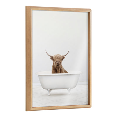 Framed printed glass art showing baby Highland cow sitting in a bathtub, by Amy Peterson Art Studio
