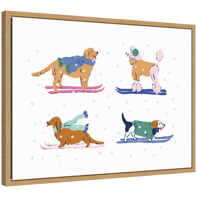 Framed canvas art of four dogs skiing, each wearing colorful scarves and sweaters, surrounded by falling snowflakes.