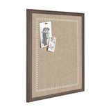 Rectangular fabric pinboard with a brown wooden frame and delicate white scalloped edge pattern, holding two black-and-white pinned photographs.