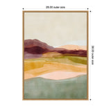 Abstract landscape with layered hills in soft green, peach, golden yellow, burgundy, and beige tones, framed in a thin light wood frame, measuring 28 by 38 inches.