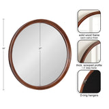 Round wall mirror with a warm walnut solid wood frame featuring a thick 1.5-inch deep scooped profile and metal D-ring hangers on the back.