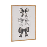 Framed artwork featuring three vertically aligned black bows with varying ribbon styles on a white background.