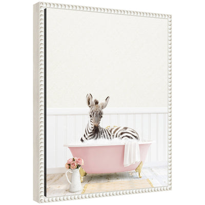 Framed canvas art depicting a baby zebra sitting in a vintage-style cottage rose bathtub surrounded by soft muted tones.
