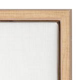 Close-up of a natural light wood frame corner with a white textured canvas stretched tightly inside, showing wood grain and frame joint detail.